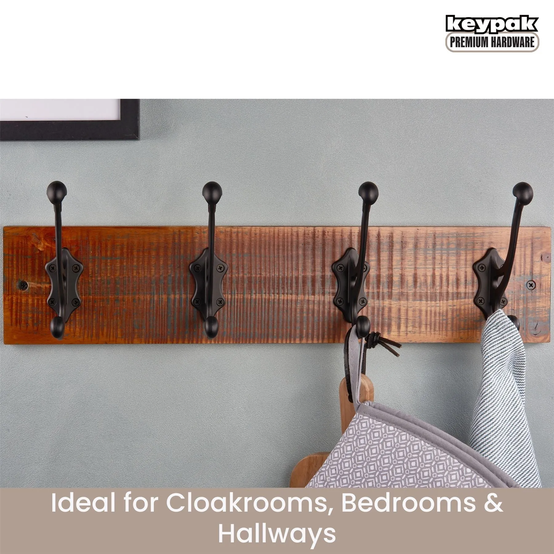 4 Black Antique-Style Hooks on Antique Wooden Board