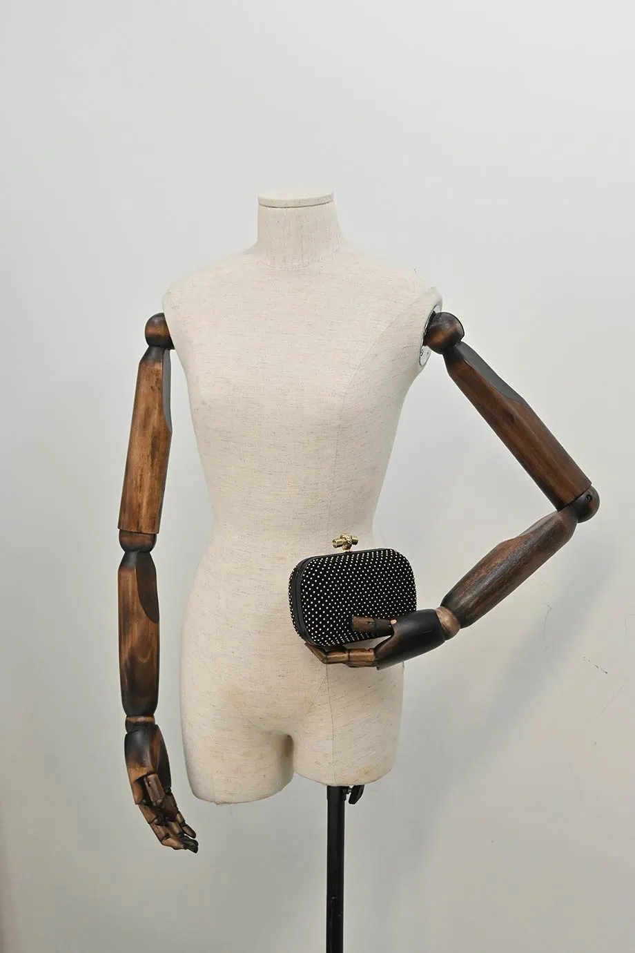 BOTTEGA VENETA Black embellished suede with python skin edges knot clutch